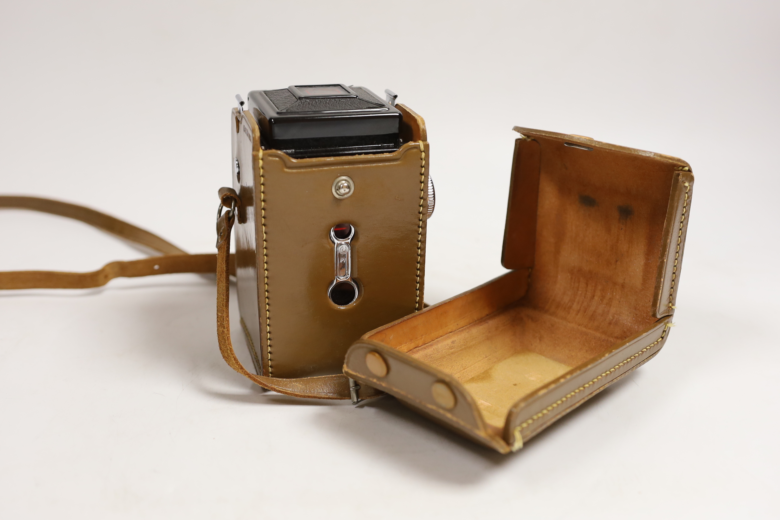 A Halina leather-cased camera, camera approx 14cm high